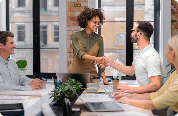 Business professionals shaking hands, symbolizing honesty and trust in Mealzo partnership
