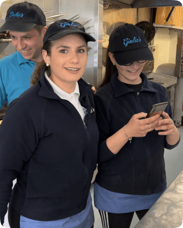 Giulio's Fish and chips takeaway's staff in Falkirk